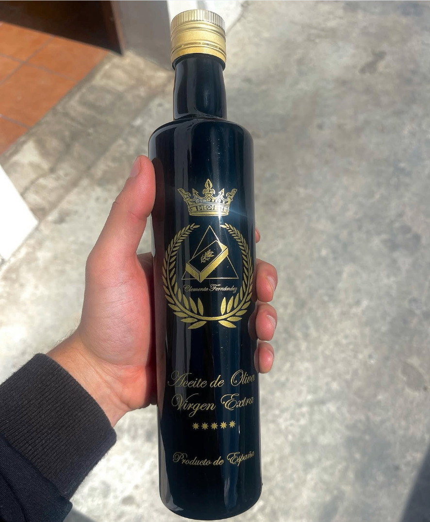 Schwarze Glasflasche Clemente Fernández mit goldener Krone